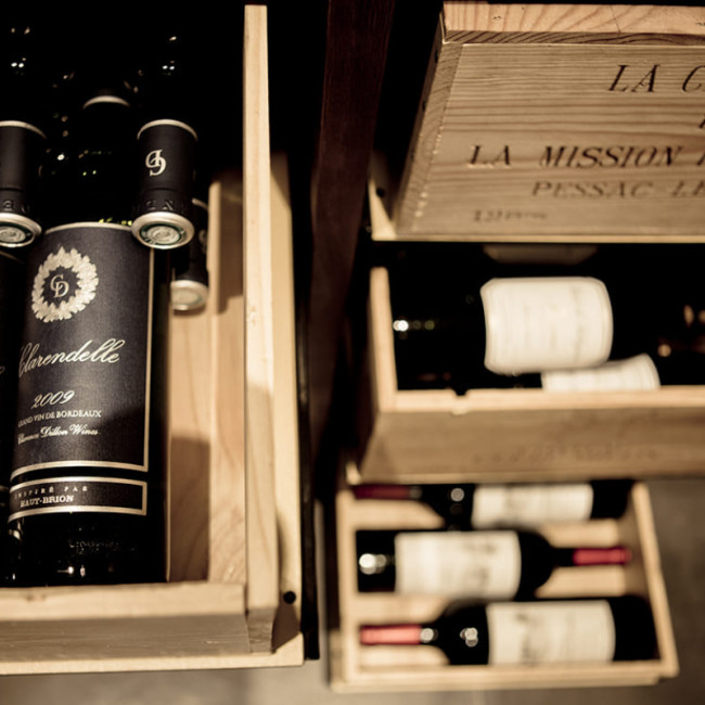 EuroCave sliding wine case rack in wood and steel, 12-bottle storage.