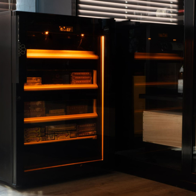 Cigar humidor cabinet with integrated amber light: lighting from above and light strip all around the humidor.