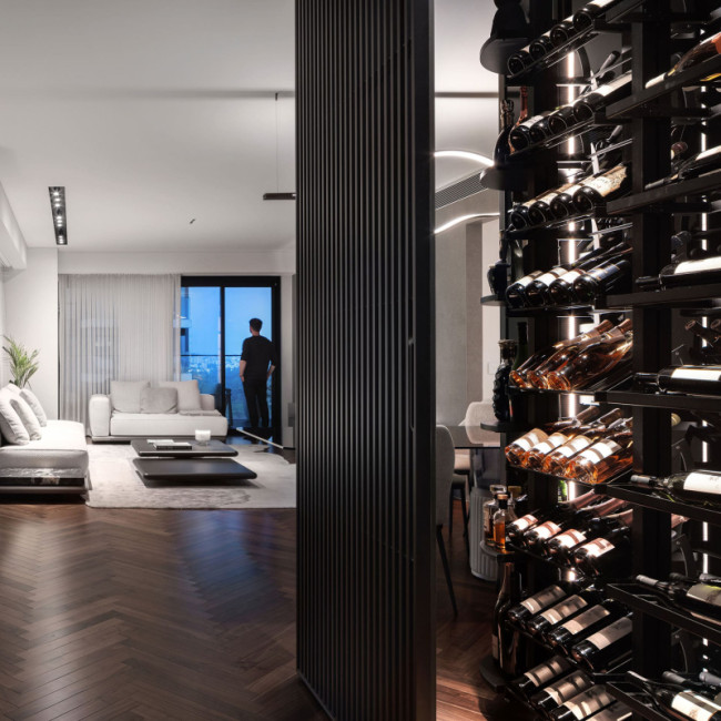 Glass-enclosed wine room integrated into the living room as a key element of the apartment's interior architecture – Modulo-X EuroCave