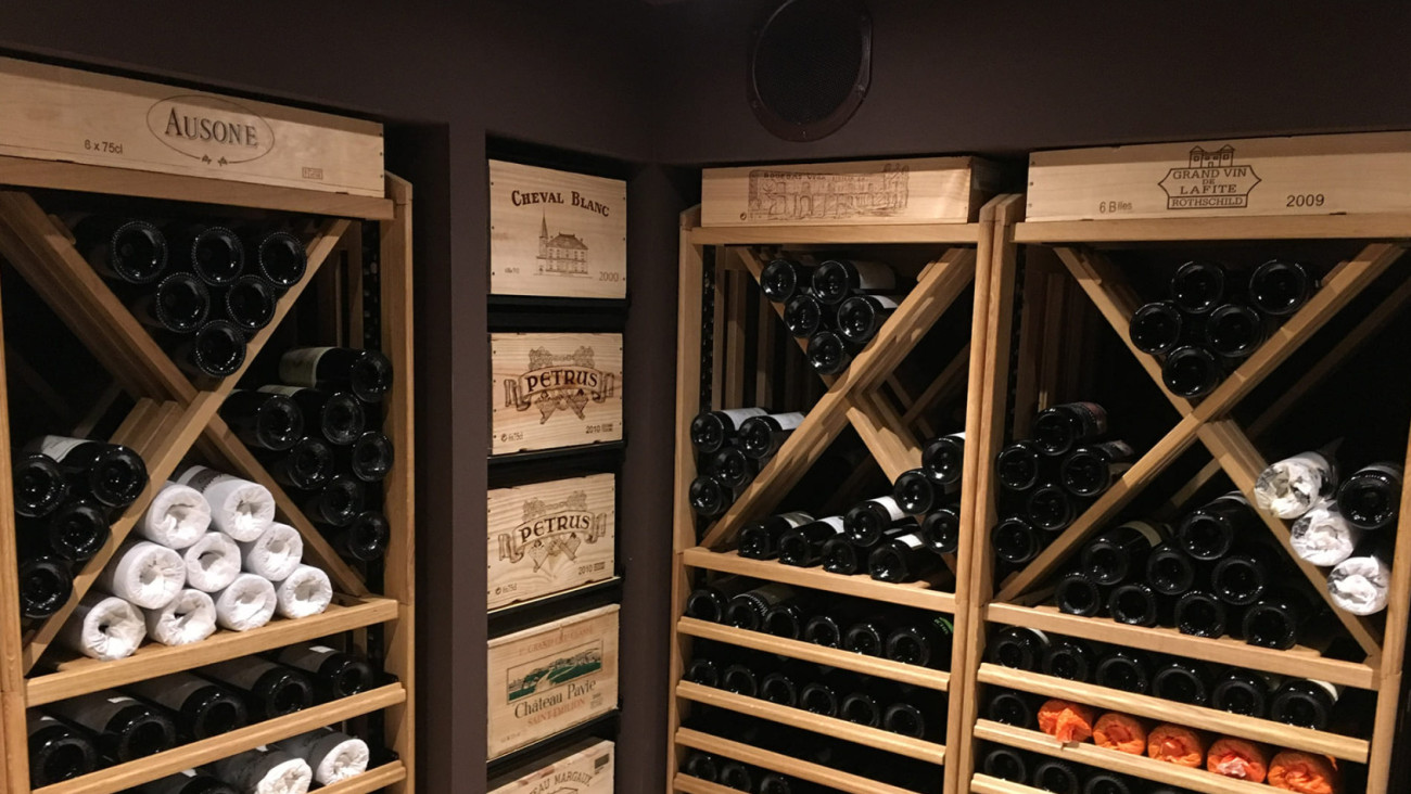 What is the aging potential of tannic wines?   Photo of EuroCave’s modular wooden wine storage.