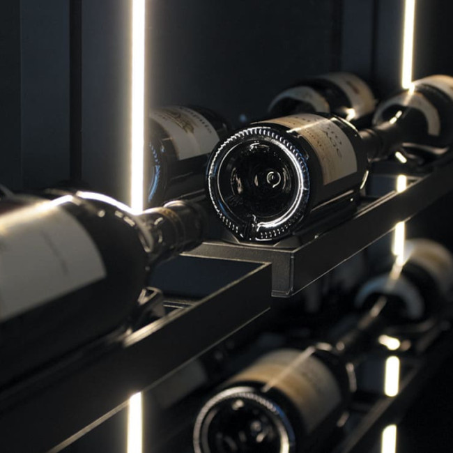 Wine cellar storage shelves with integrated lighting and multiple bottle display options.