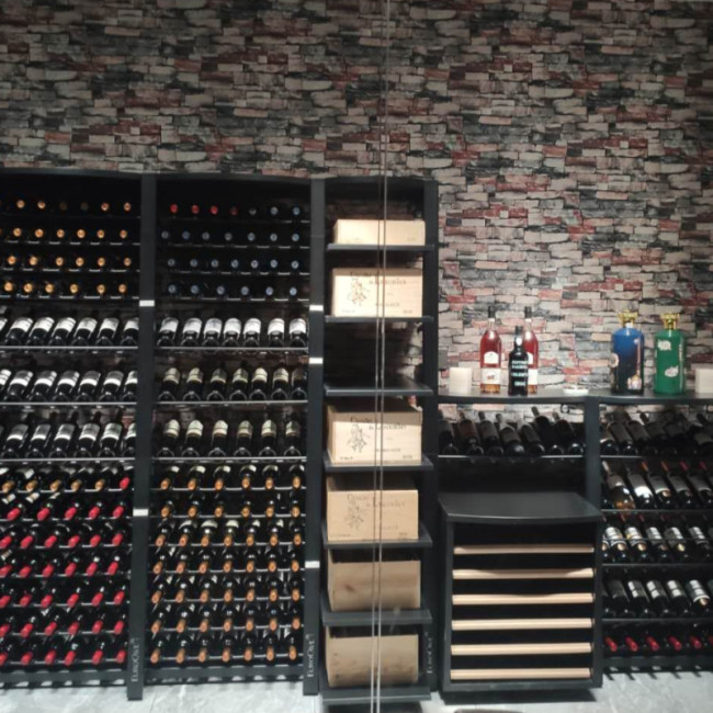 Climate-controlled wine showcase. Modular and functional metal wine cellar storage with sliding racks or wine case options. Individual bottle holders.
