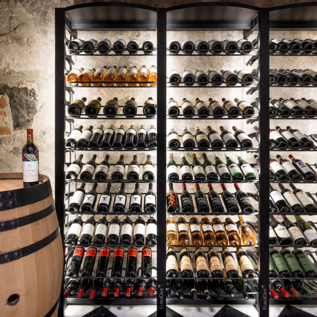 Sturdy modular metal shelves for climate-controlled wine rooms. Large-capacity wine display and storage.