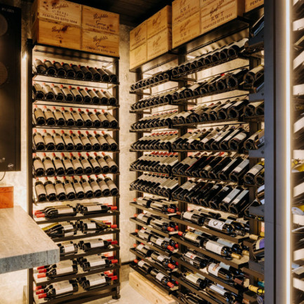 Wine collection safely stored in a prestigious cellar layout with EuroCave’s Modulo-X modular steel racks.