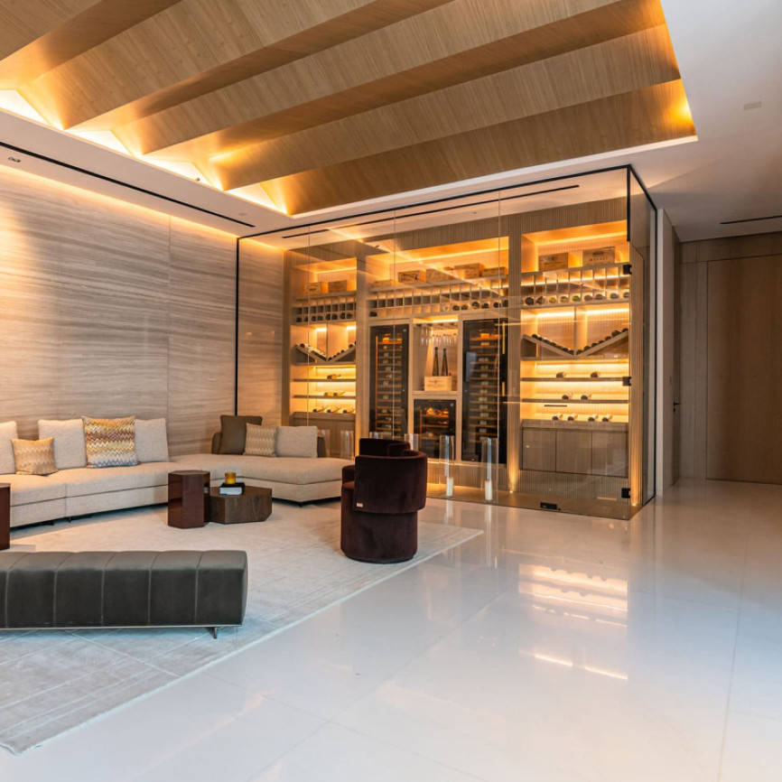 Stunning climate-controlled wine room seamlessly integrated into the interior architecture of a luxury home.