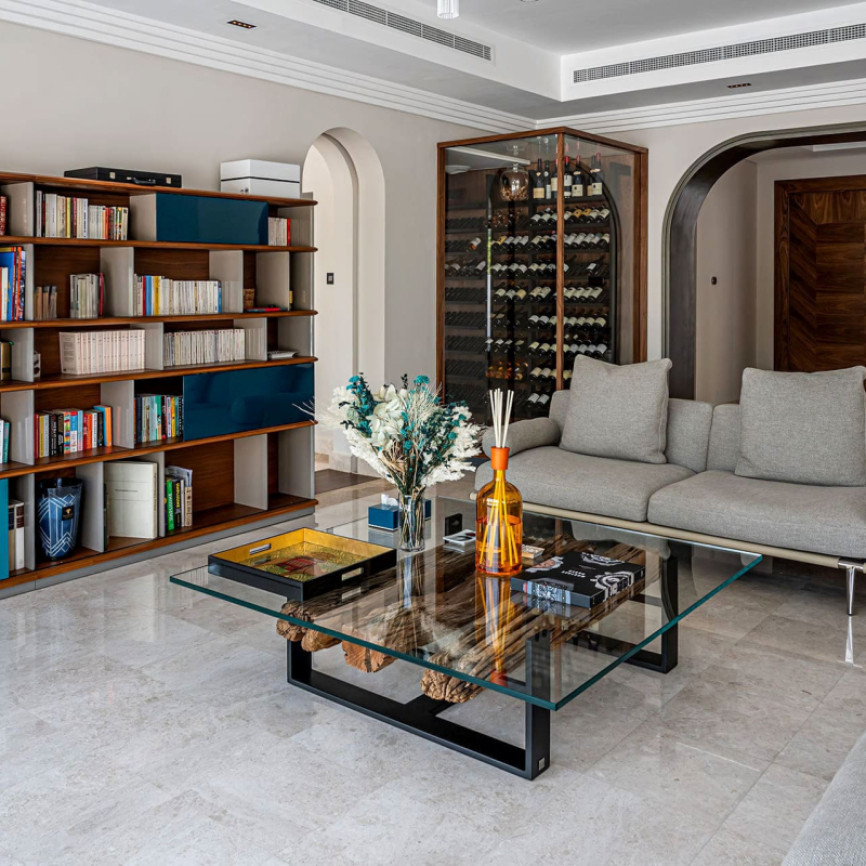 Climate-controlled wine display integrated into the living room of a modern home.