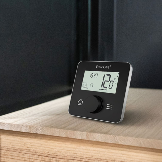 Wine cellar air conditioner with remote control for remote adjustment of temperature and humidity in the room.