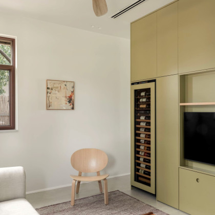 Bespoke interior cabinetry in Israel featuring an integrated EuroCave wine cooler.