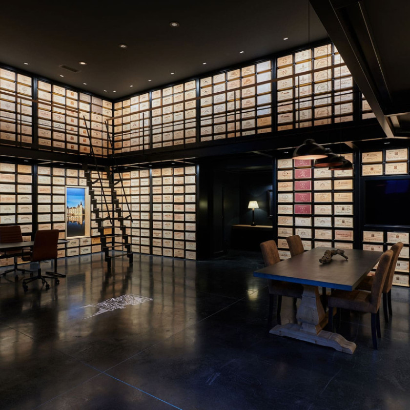Incredible wine tasting room fully fitted with EuroCave Modularack sliding racks for wood cases.