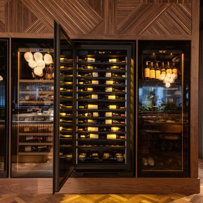 Side view of a professional wine display wall at Fazenda Group Restaurant, UK.